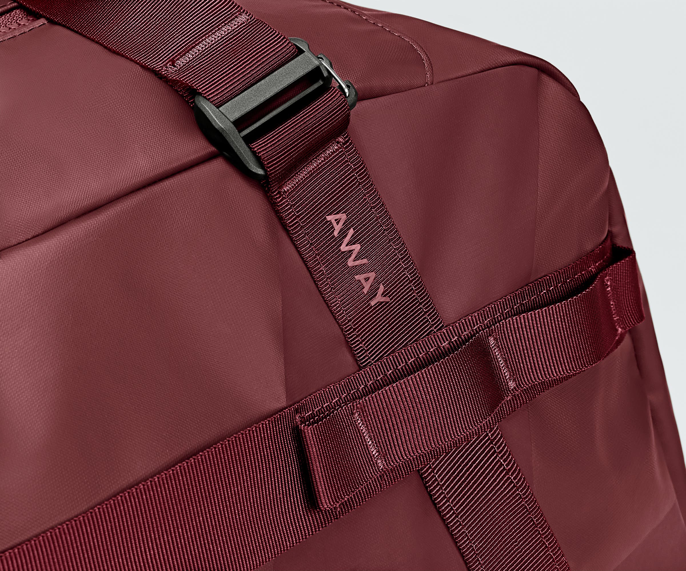 Close up view of the abrasion-resistant material and Away logo