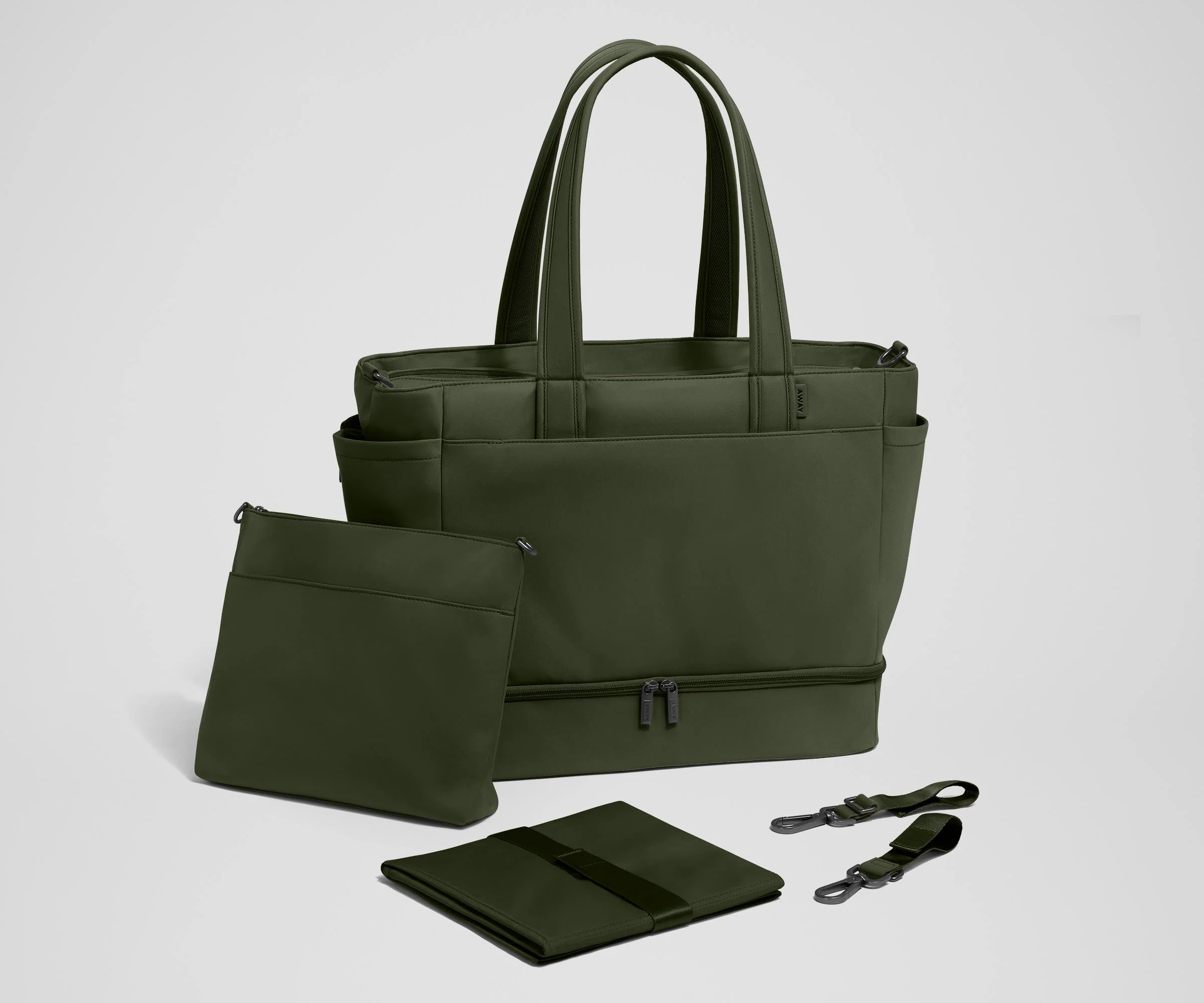 Tote with the included stroller clips, carry-all pouch, and changing pad
