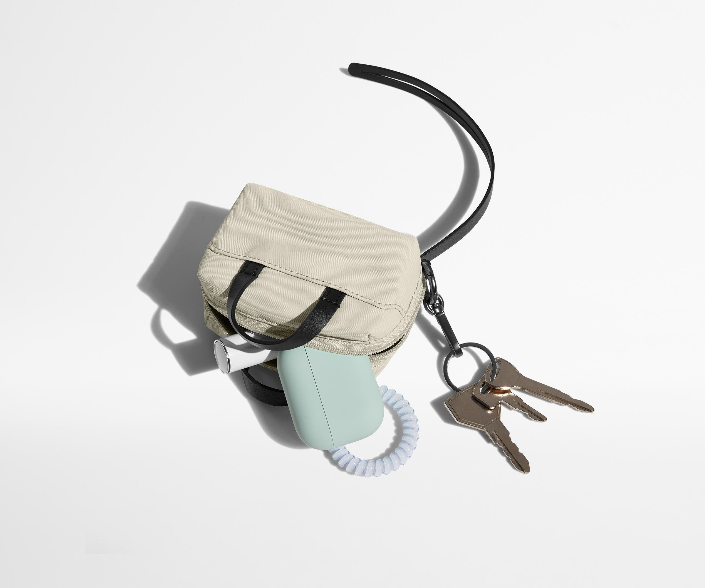 Micro Everywhere Bag packed with earpods, chapstick, and keys attached