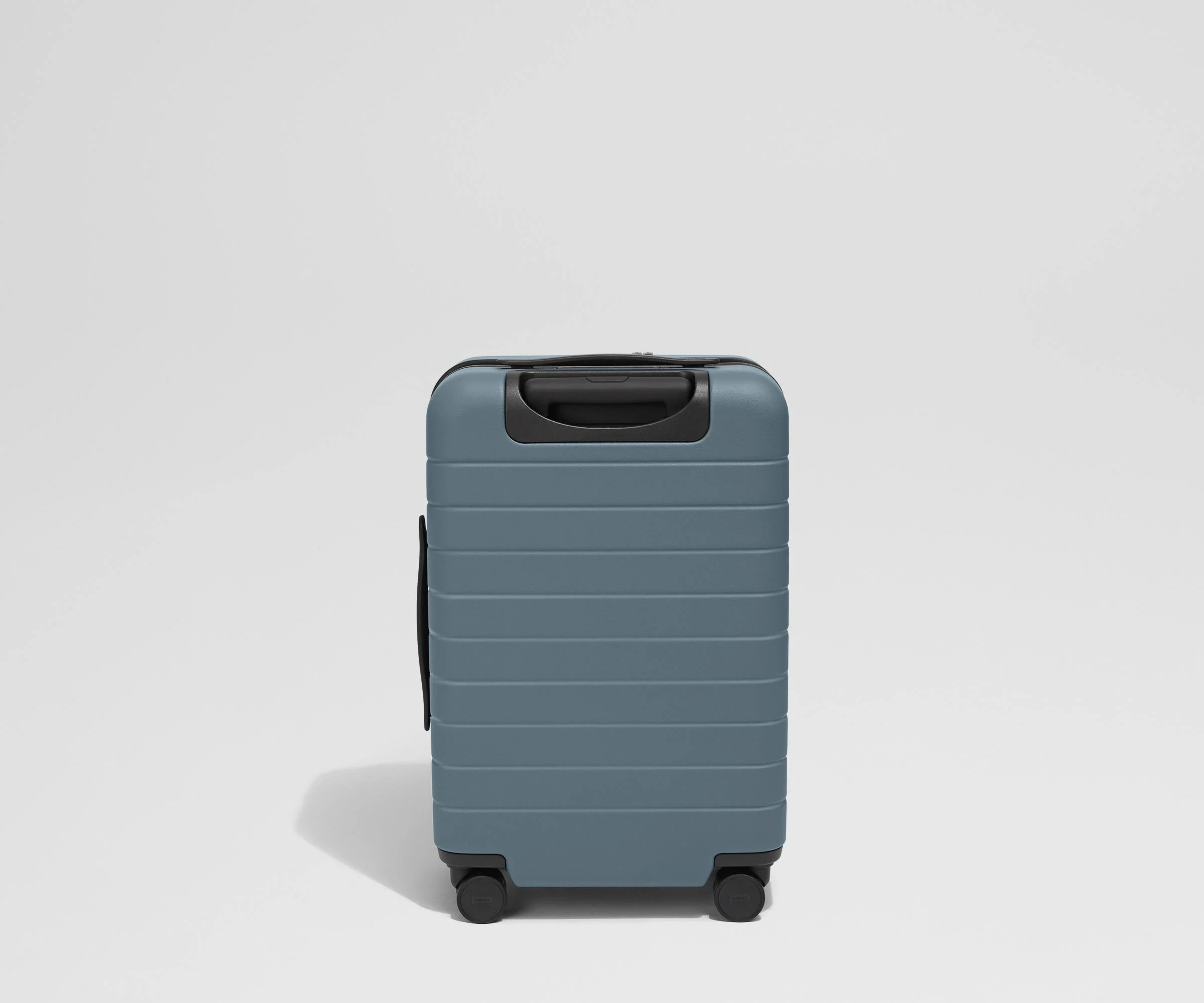 Back product view of The Front Pocket Carry-On suitcase in Coast Blue