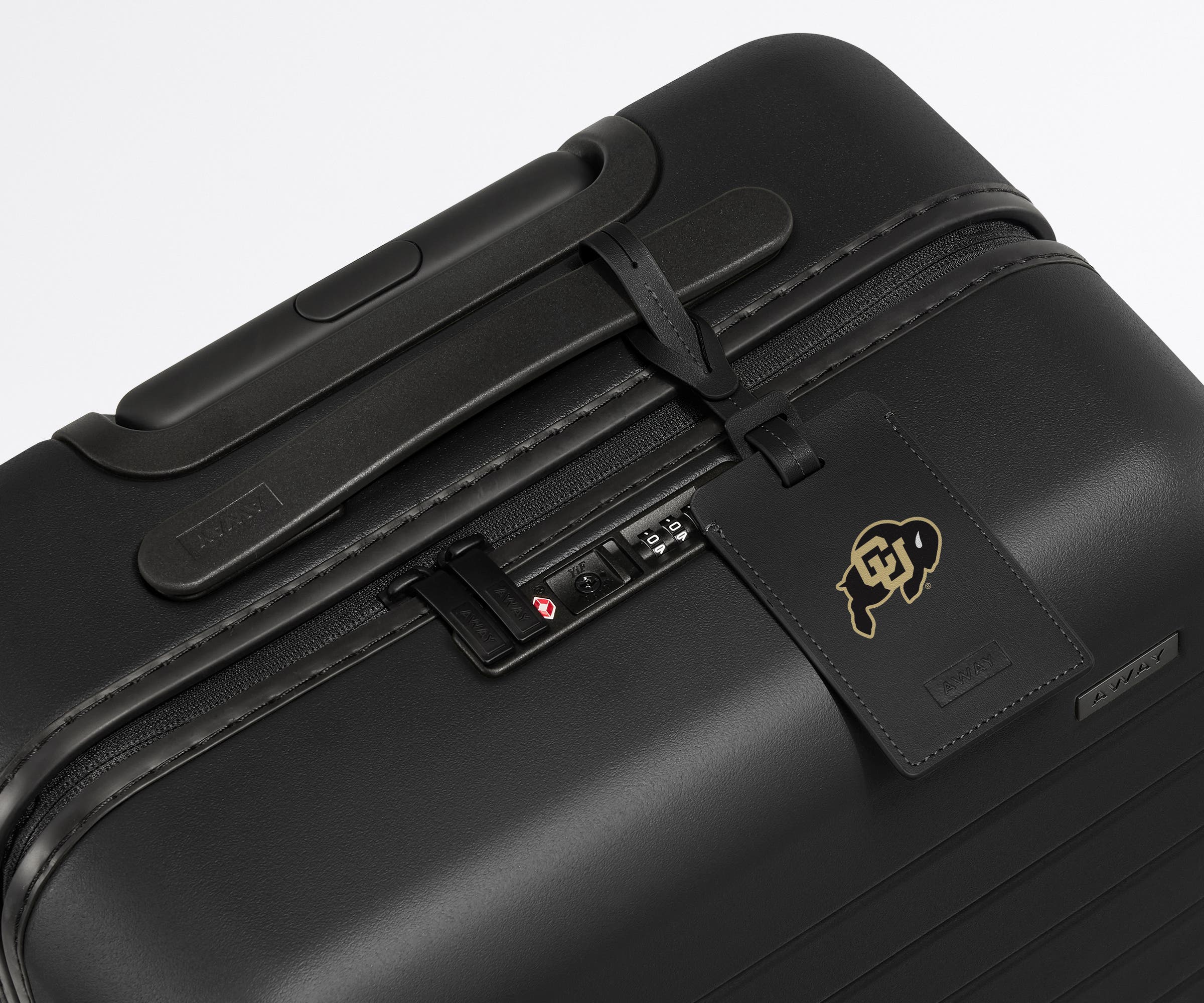 University of Colorado ® Collegiate Luggage Tag on a matching Collegiate Bigger Carry-On suitcase