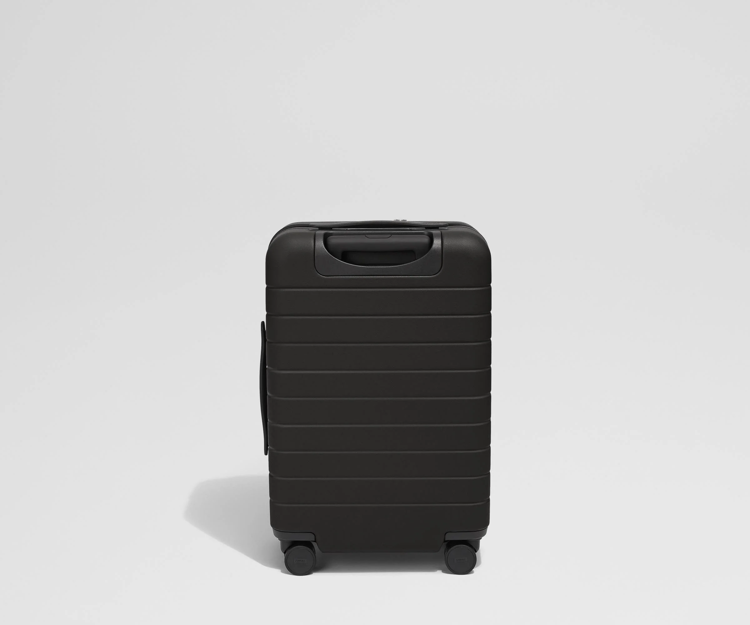 Back product view of The Front Pocket Carry-On suitcase in Jet Black