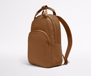 Video of a person packing the Featherlight Backpack with daily essentials
