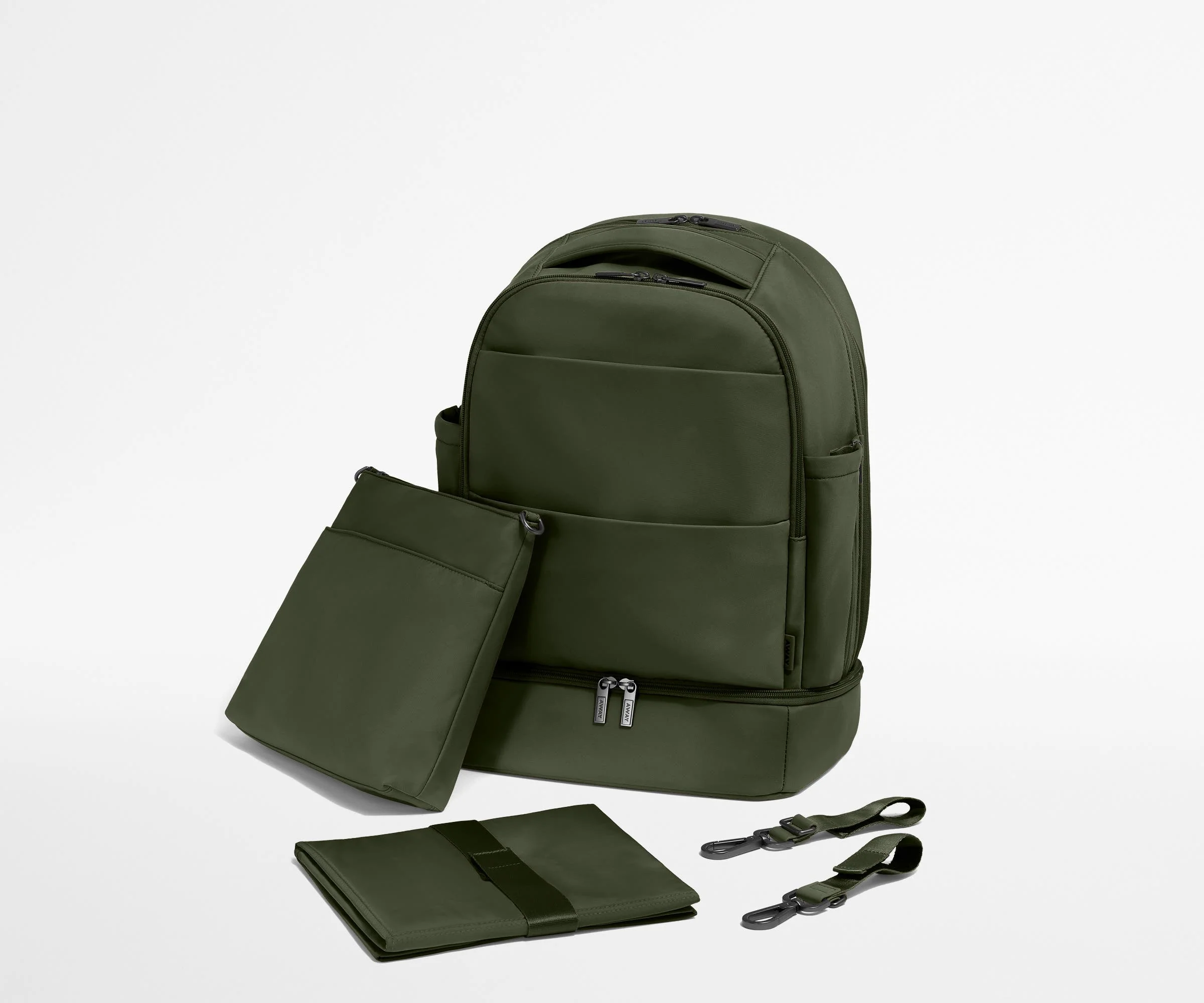 Backpack with the included stroller clips, carry-all pouch, and changing pad