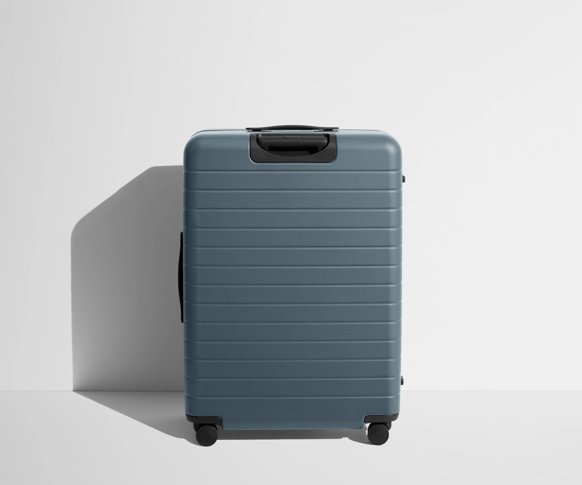 Back product view of The Large suitcase in Coast Blue