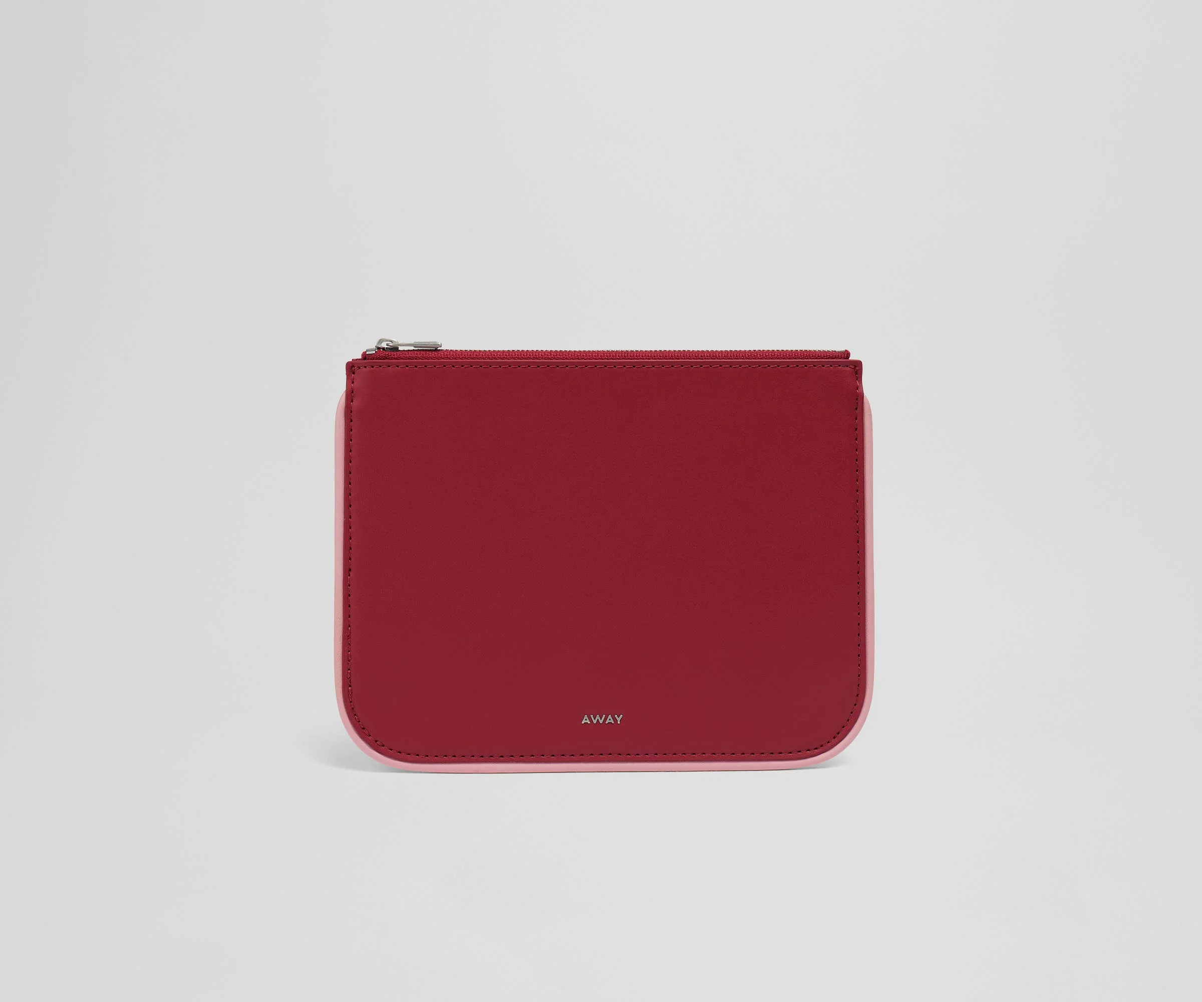 Front view of the small leather pouch with the Away logo
