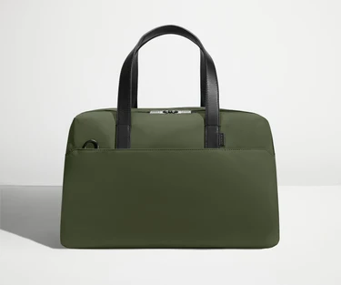 Front view of The Overnight Bag with leather straps up