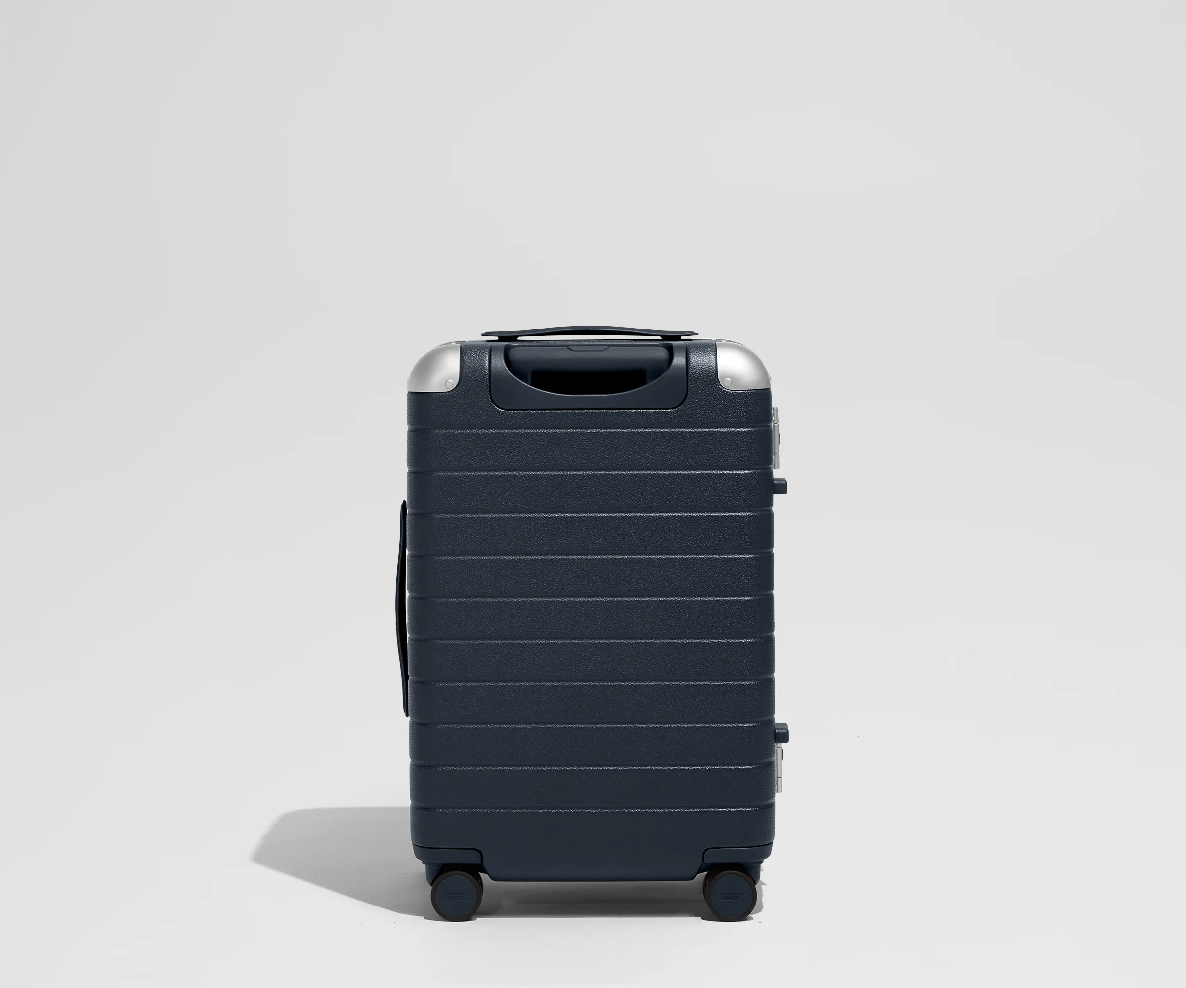 The Aluminum Edge Bigger Carry-On in Navy Blue
