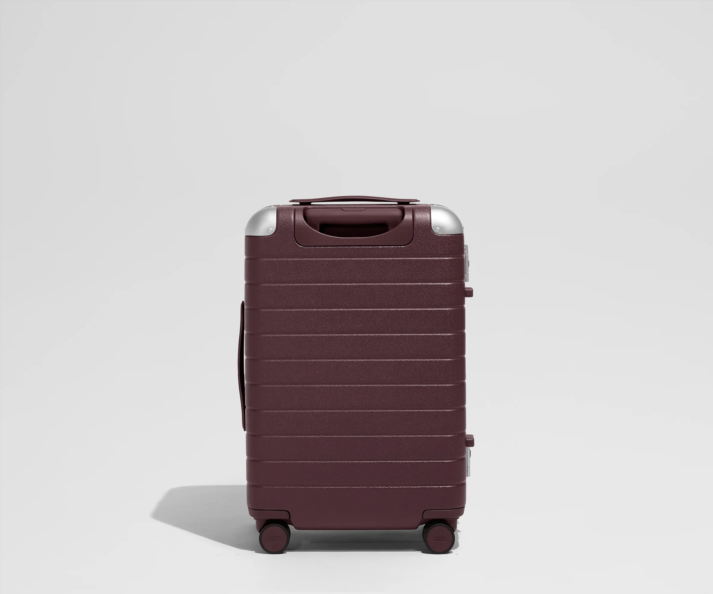 The Aluminum Edge Bigger Carry-On in Oxblood Red