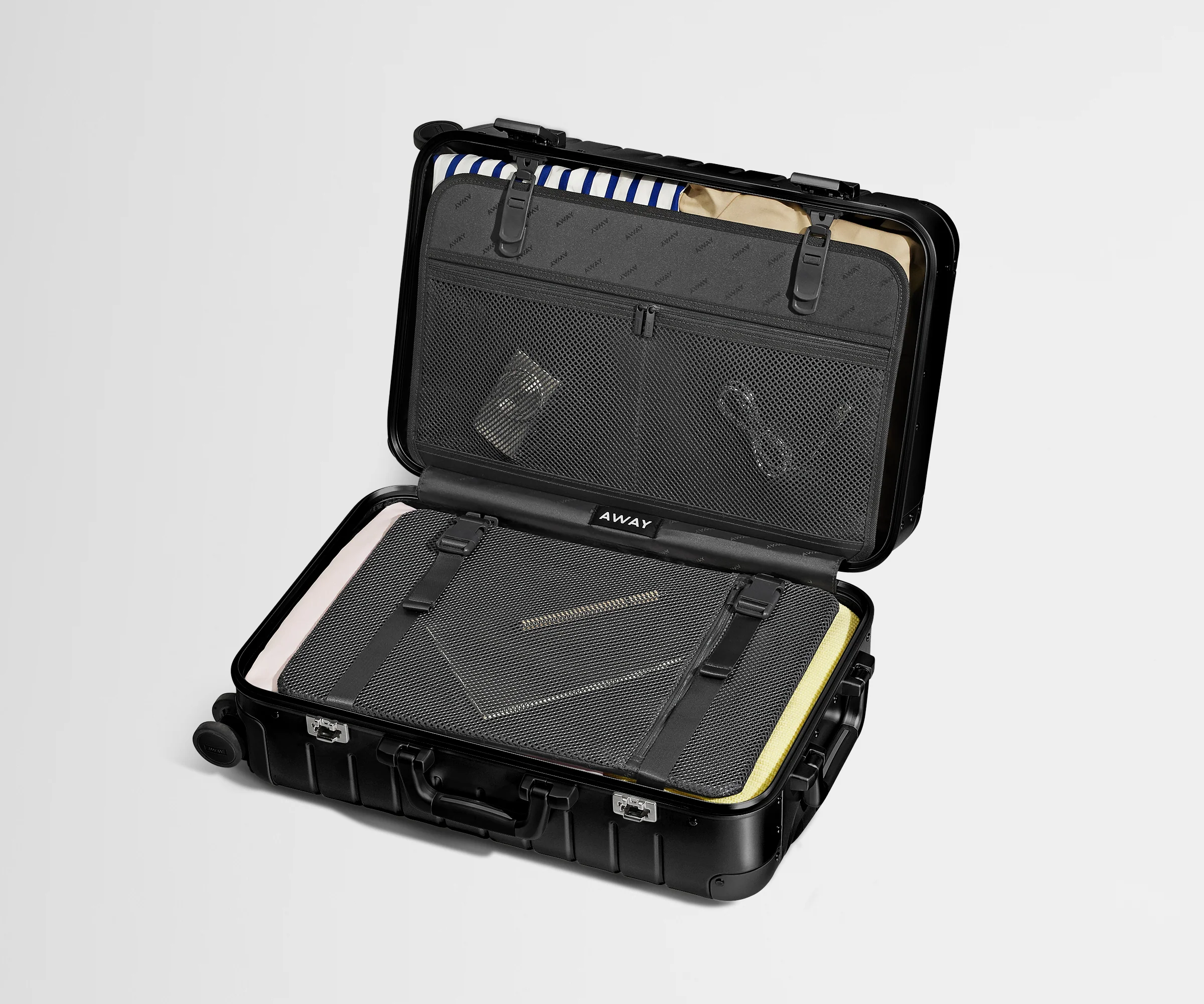 Packed view of an Aluminum Bigger Carry-On, showing the compression pad and interior organization