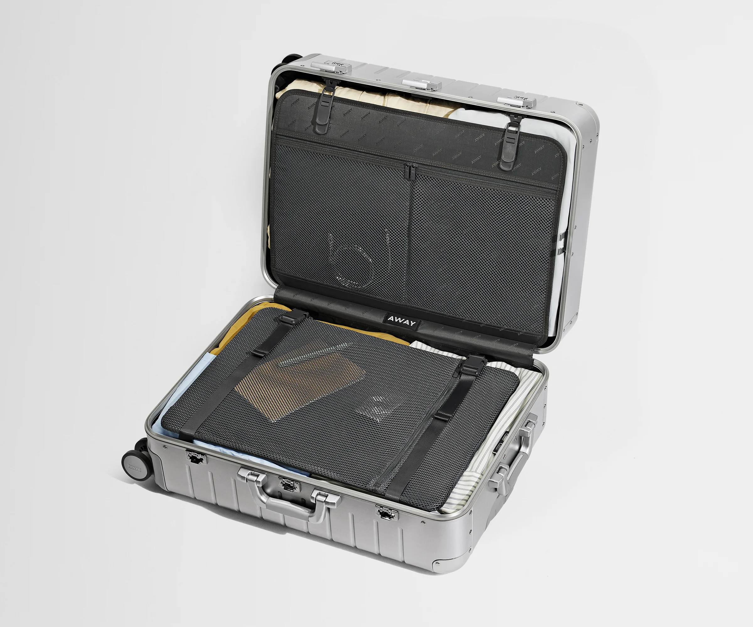 Medium: Aluminum Edition packed, showing the compression pad system and interior organization