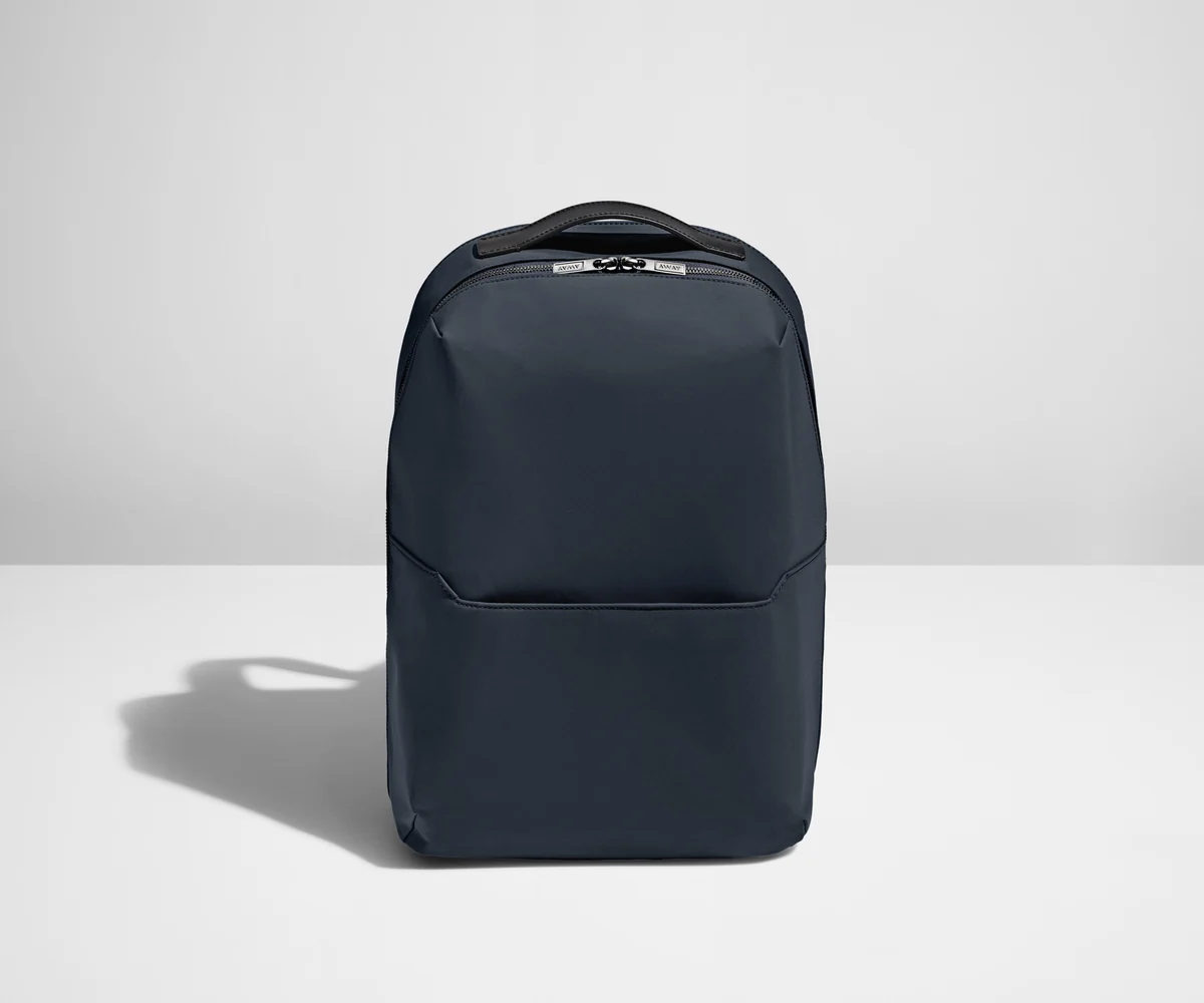 Backpack in Navy with one small pocket in the front.
