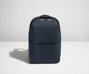 Backpack in Navy with one small pocket in the front.