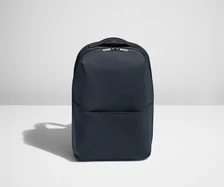 Backpack in Navy with one small pocket in the front.