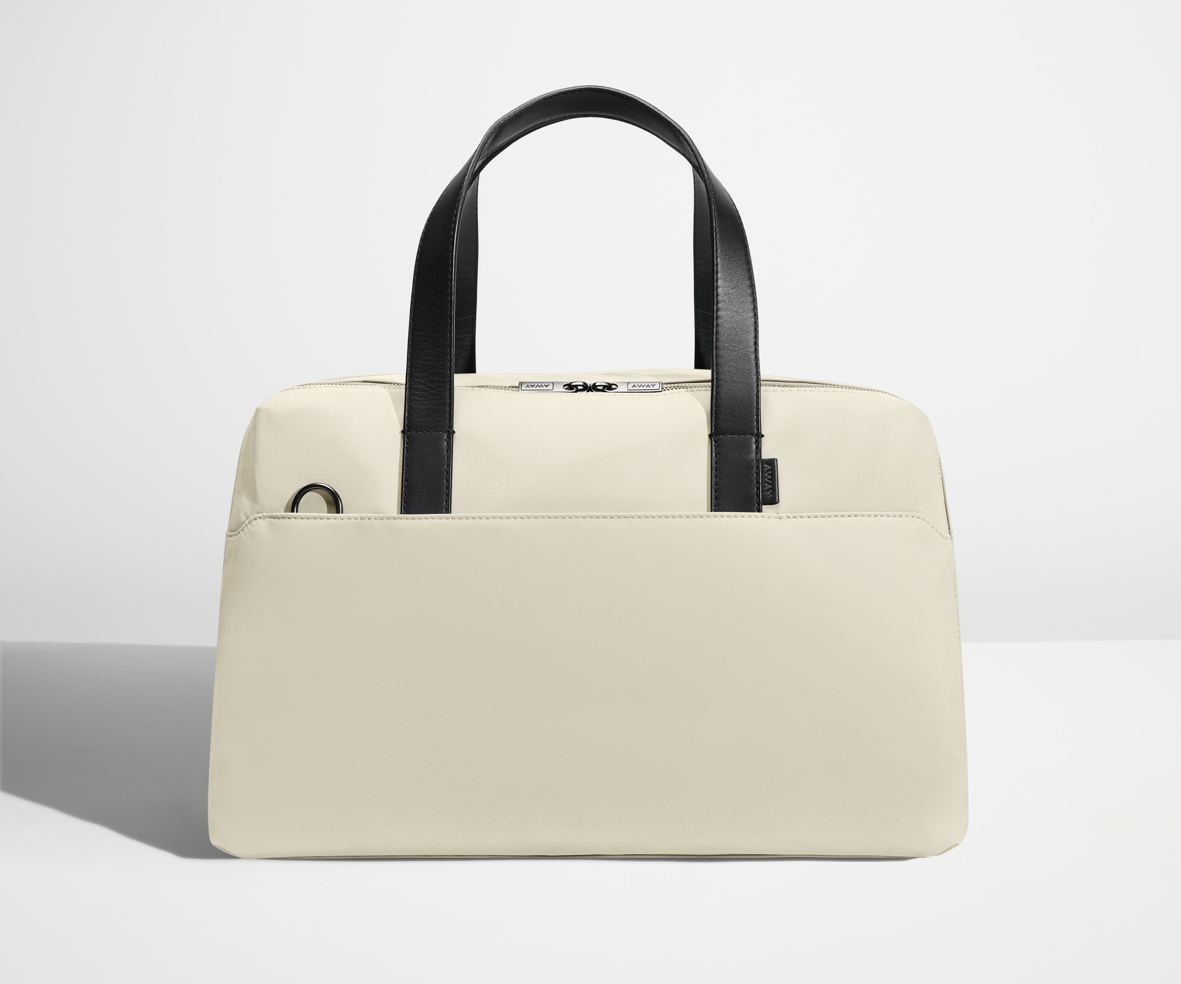 Front view of The Overnight Bag with leather straps up