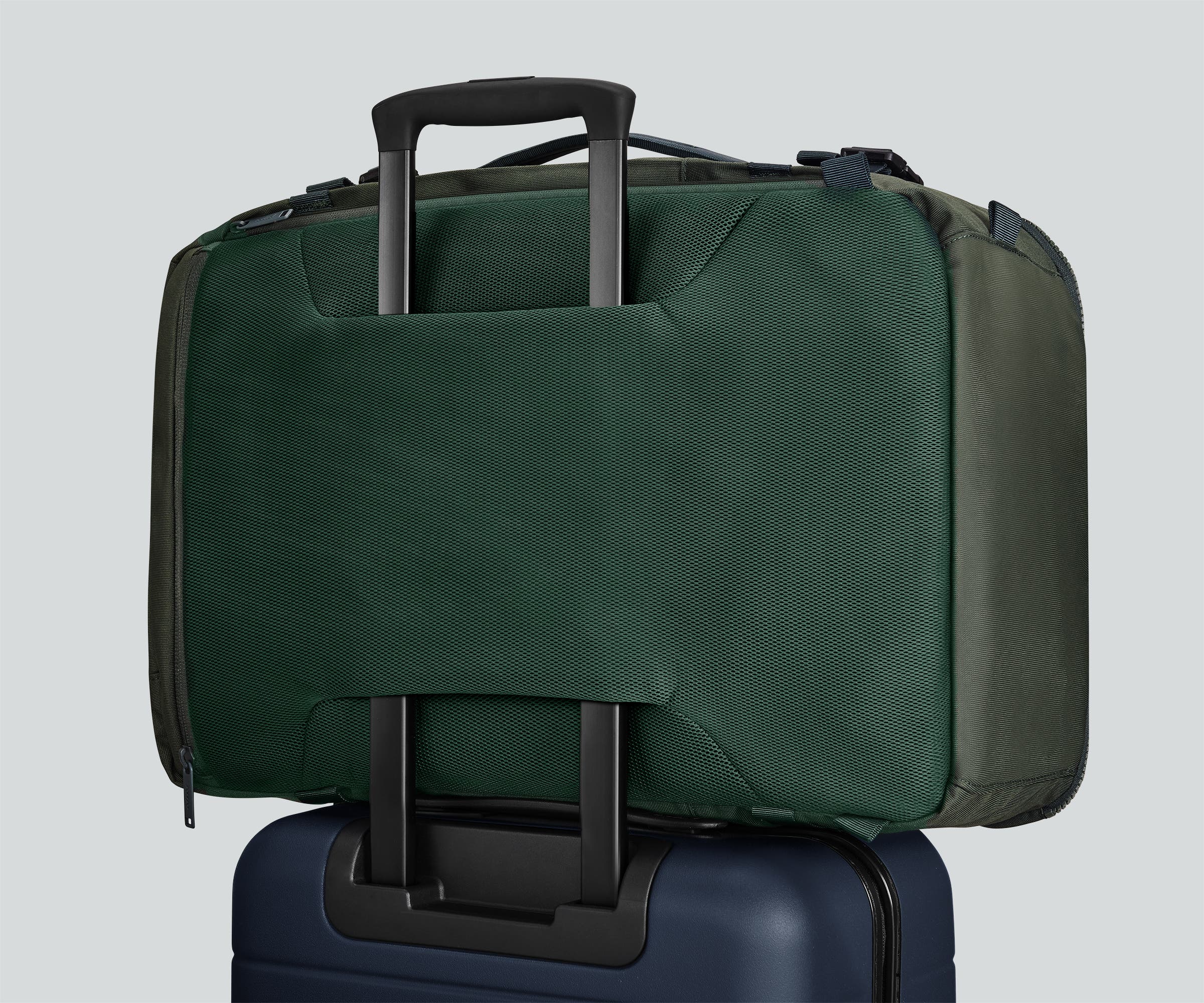 Active Convertible Backpack 45L secured to an Away suitcase by the luggage trolley sleeve