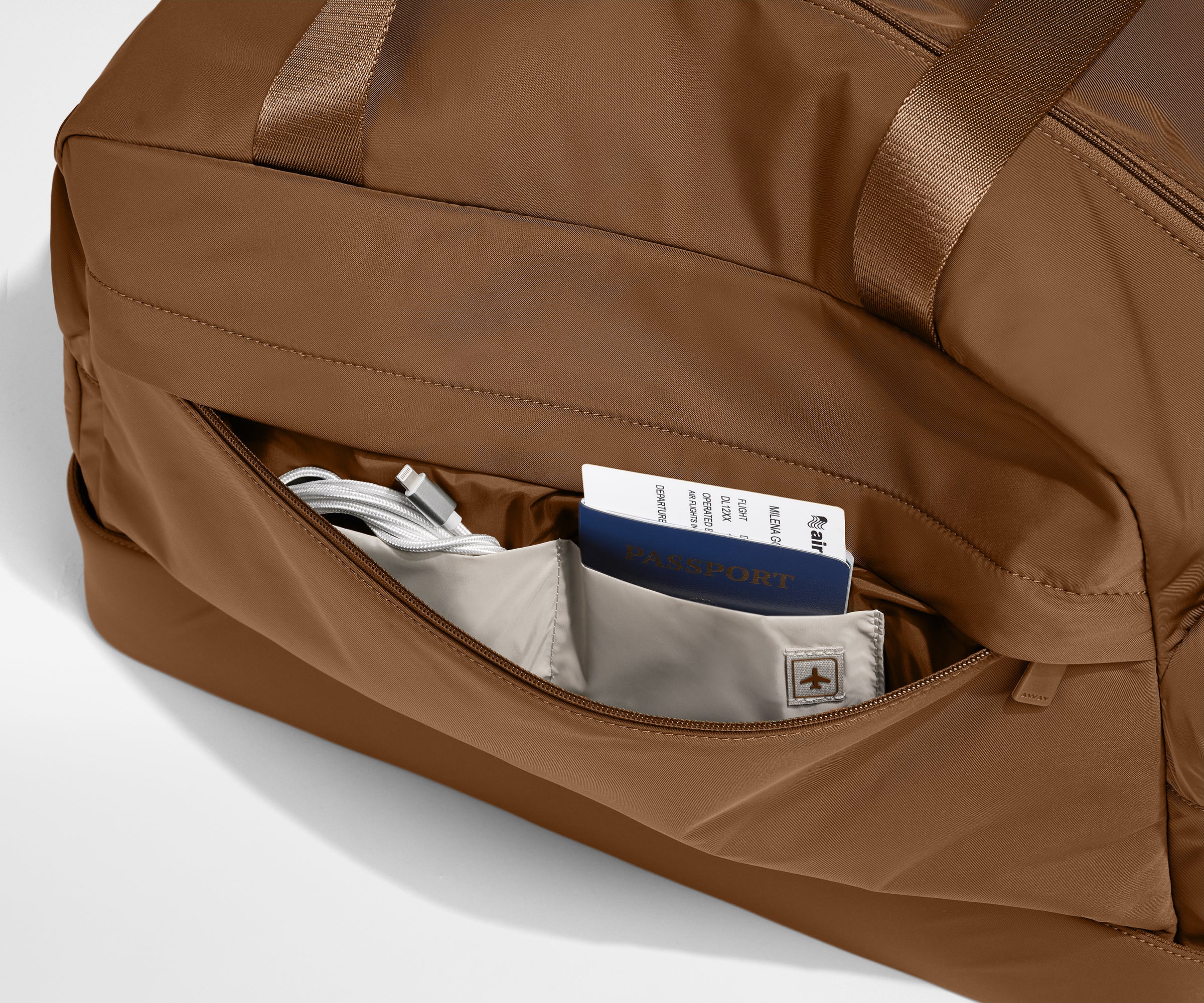 Front zipper pocket with phone and passport in their dedicated travel pockets
