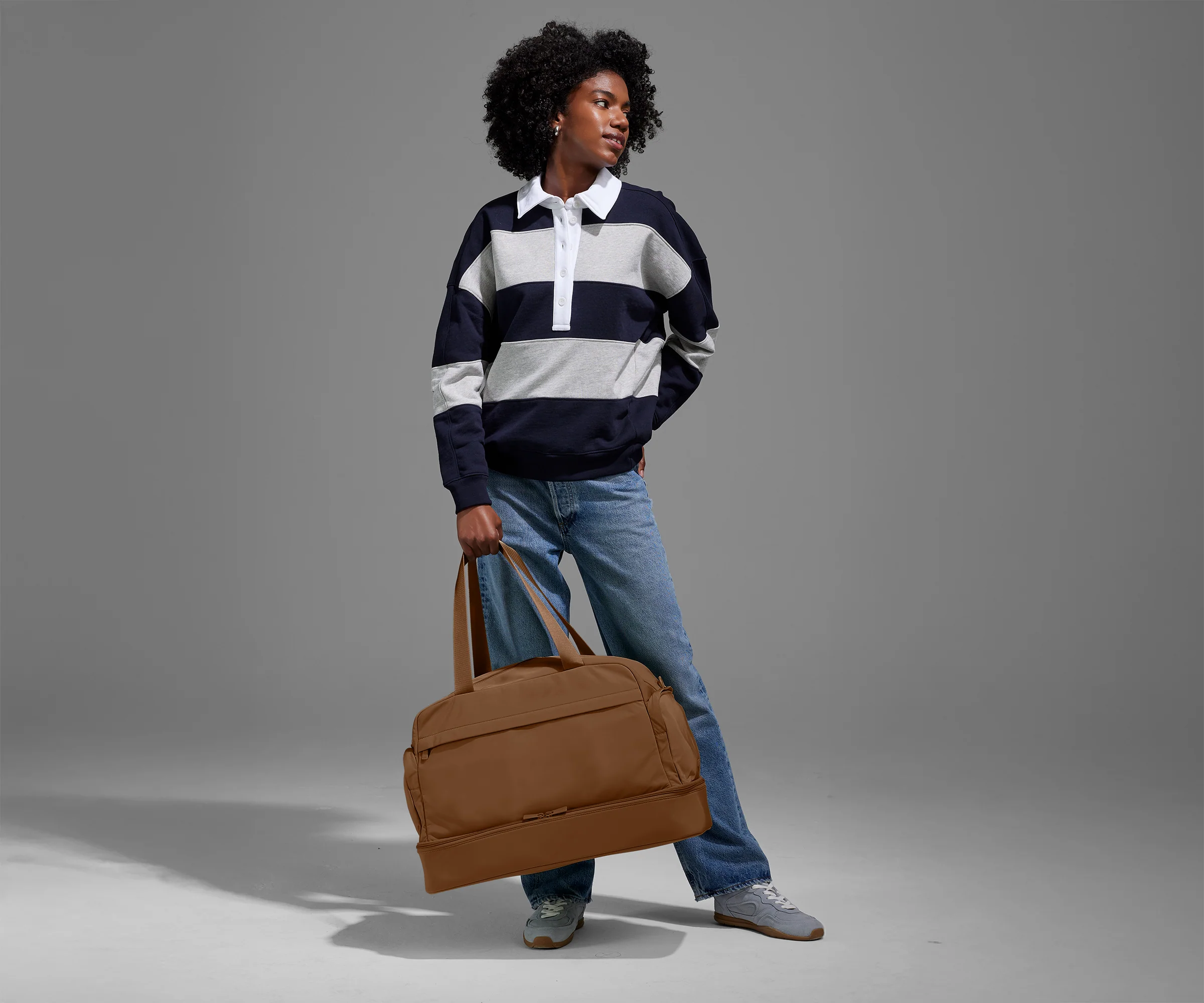 Person carrying the weekender by its handles
//
Model is 5'9"