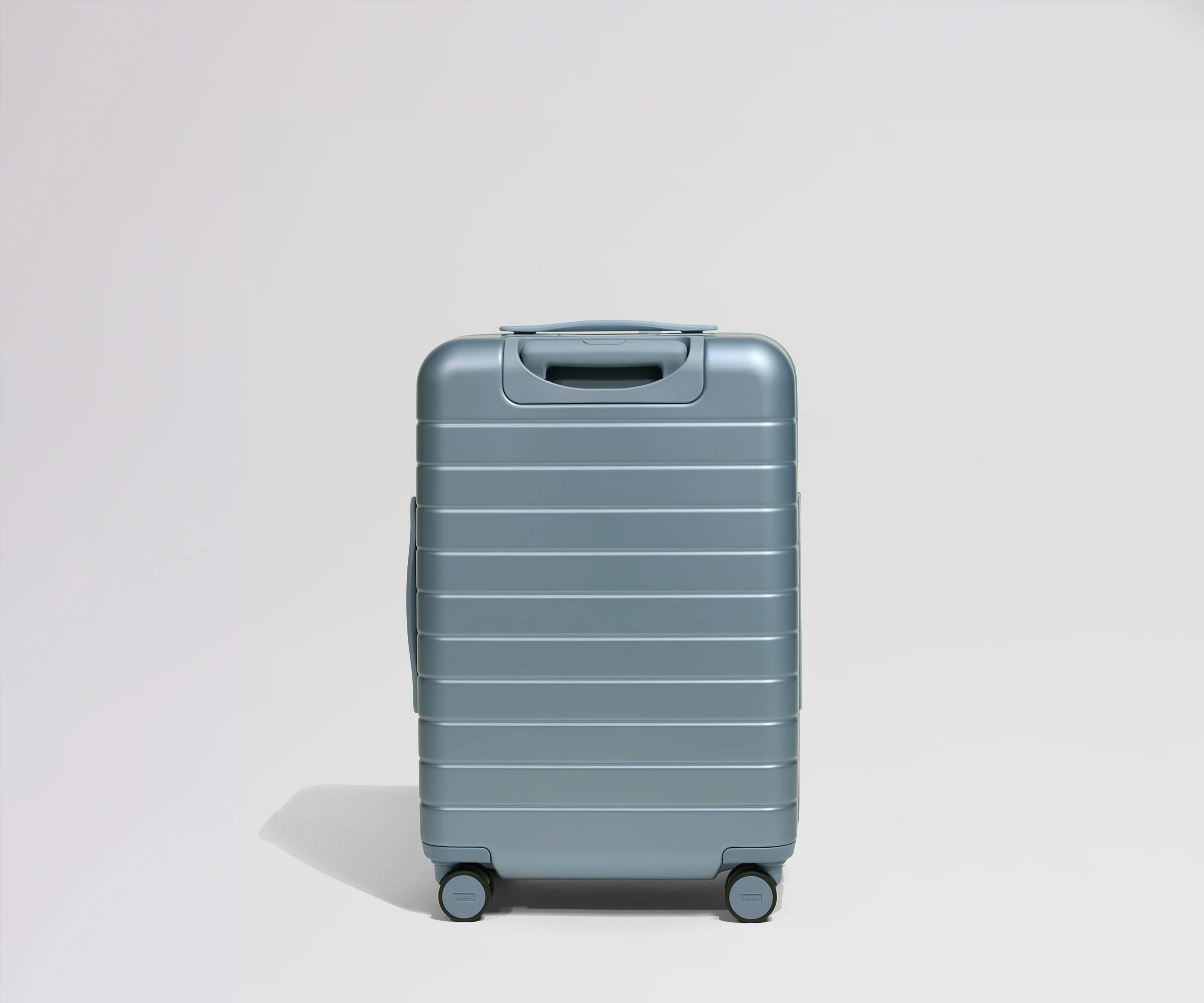 Blue suitcase on a light gray background
