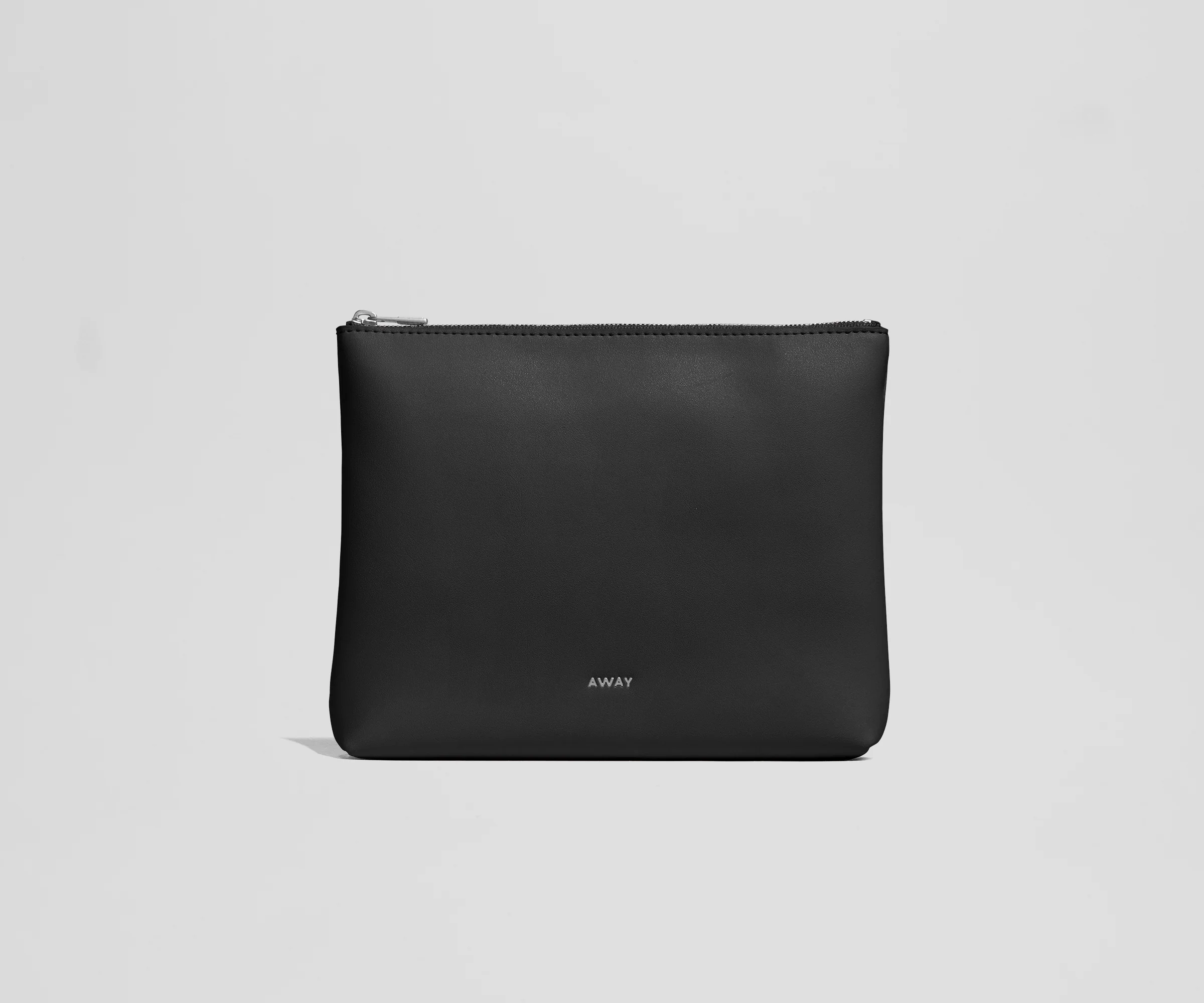 Black pouch with 'AWAY' branding on a light gray background