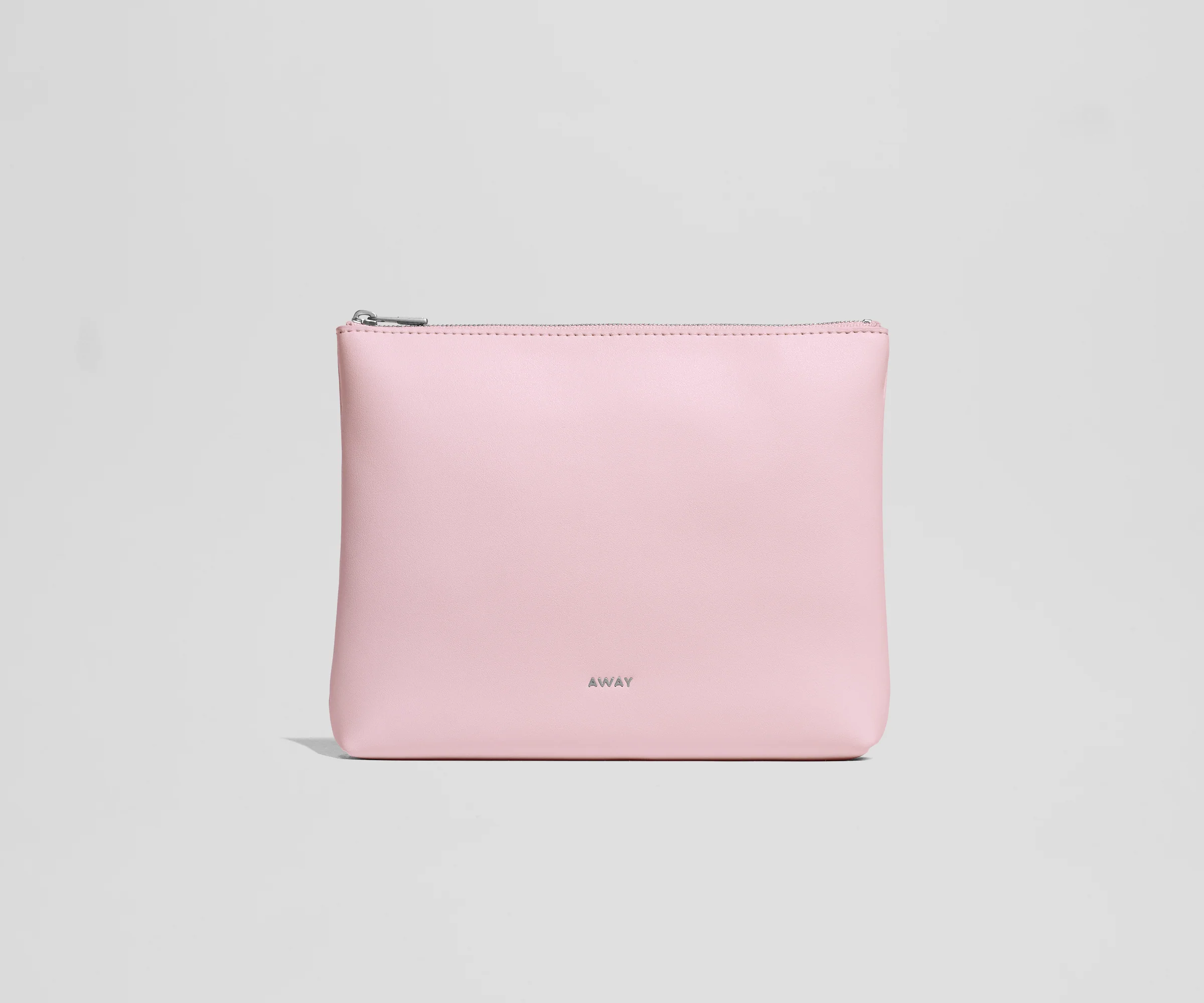 Pink pouch with an AWAY logo on a light gray background