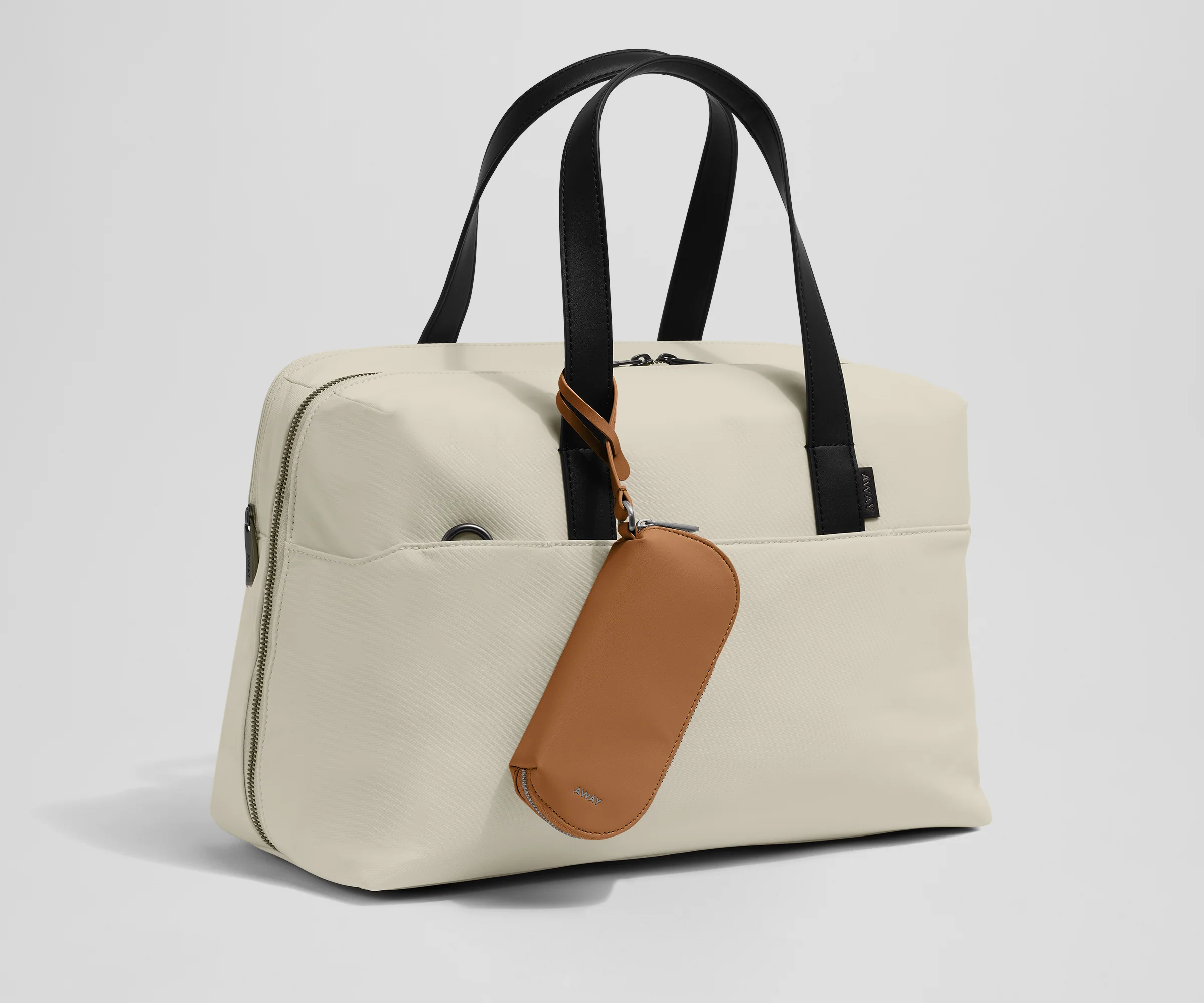 Sunglasses pouch attached to the Everywhere Bag strap