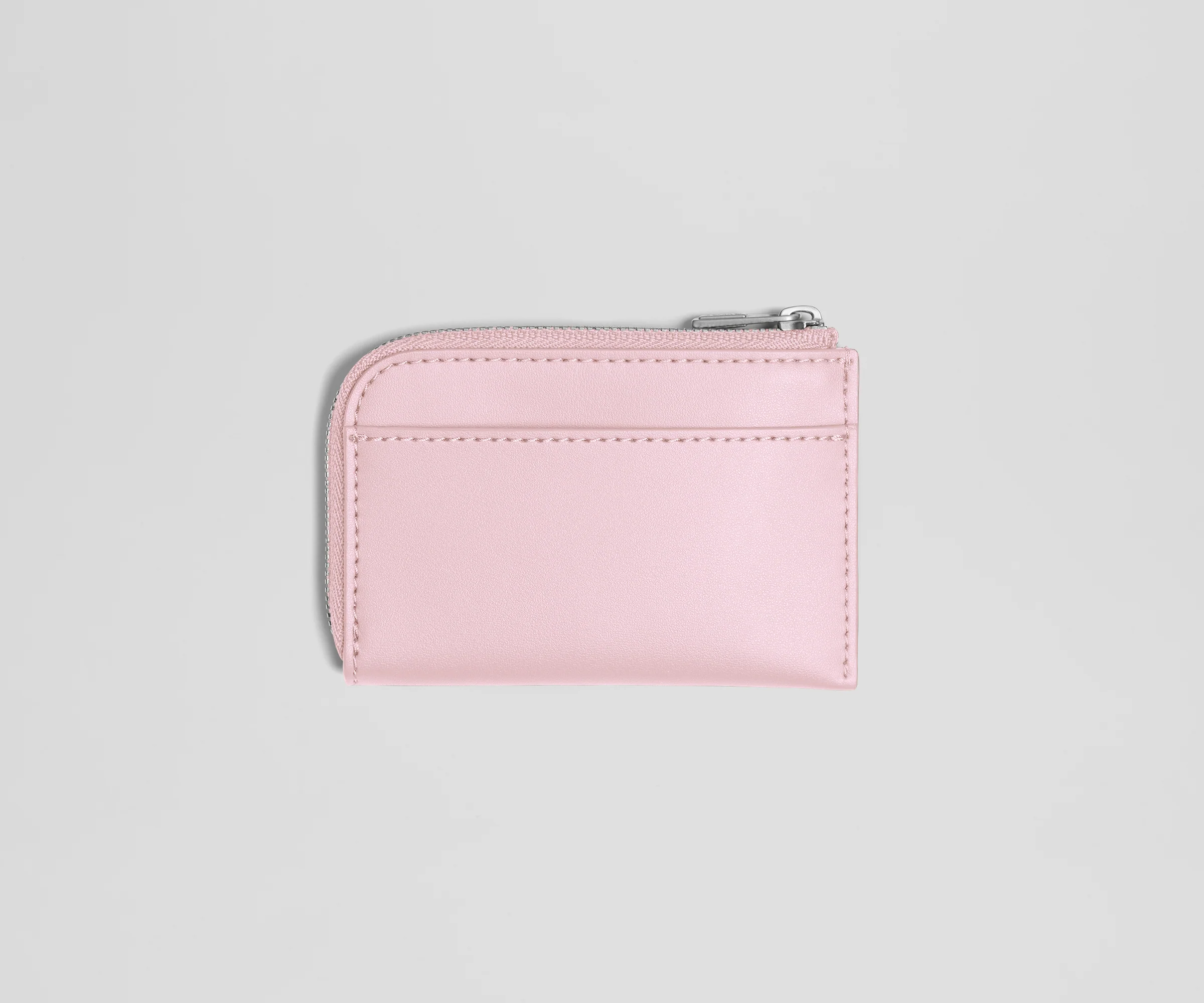 Pink wallet with a zipper on a light gray background
