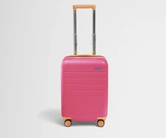 Front product view of The Kids Carry-On suitcase in Cotton Candy Pink with raised handle