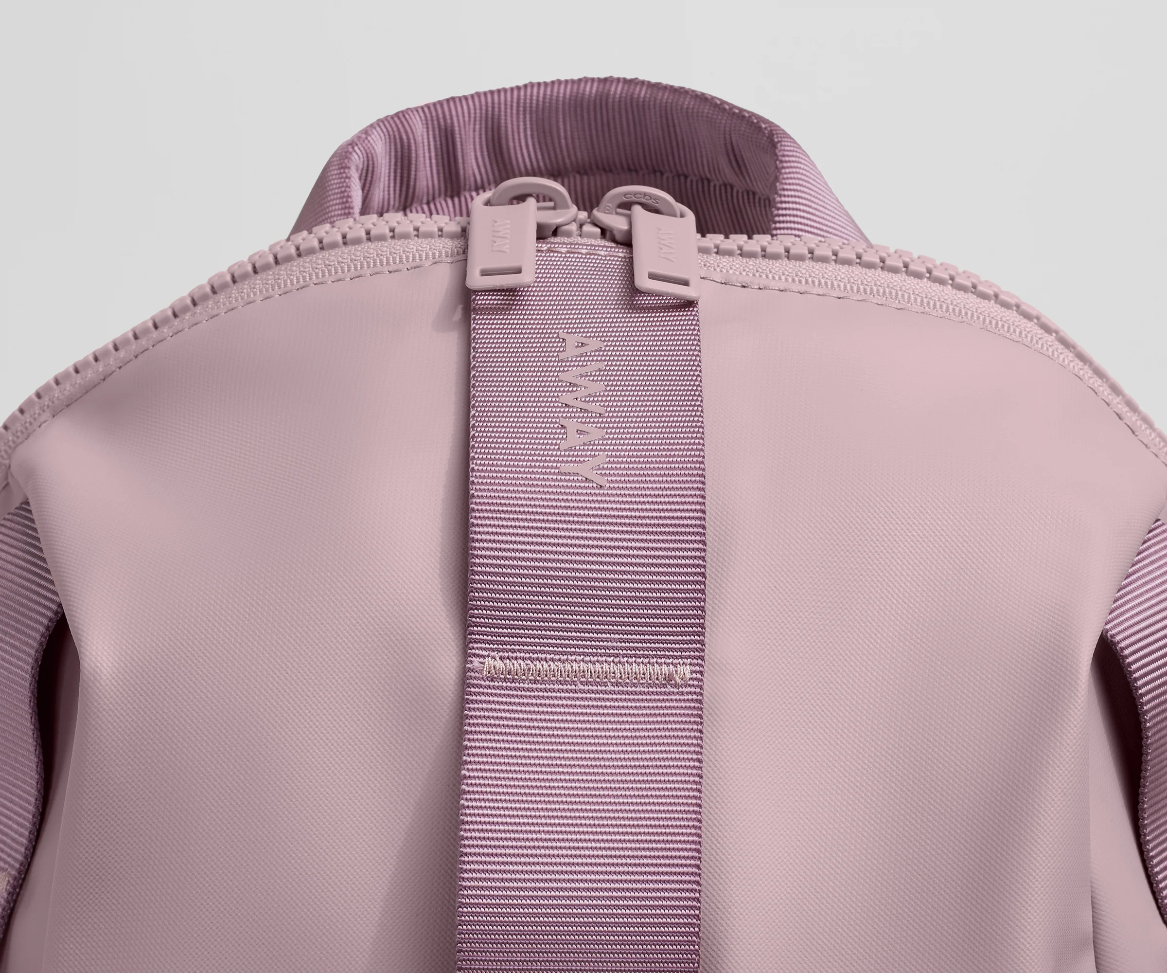Close up view of the material and Away logo
