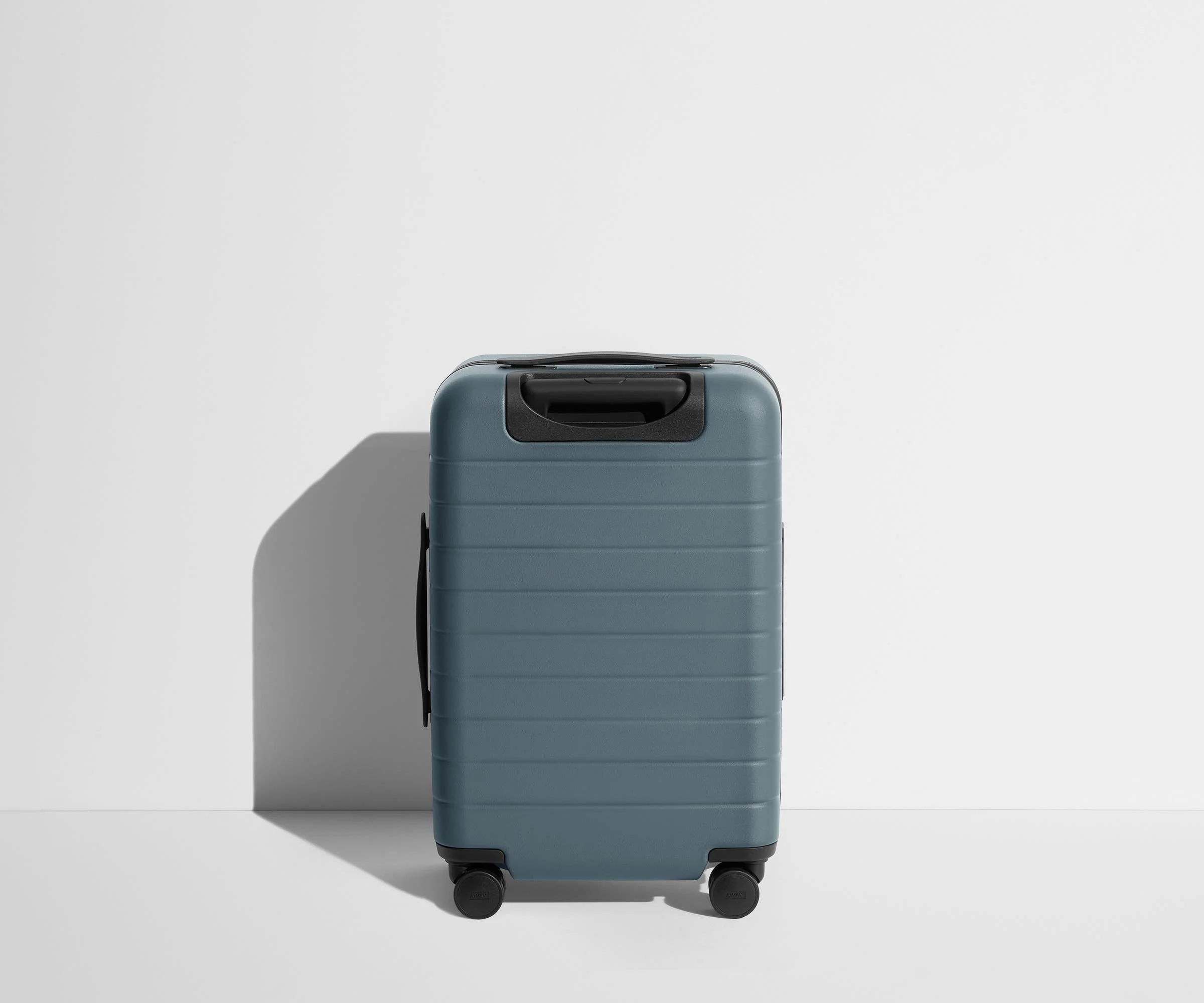 Back product view of The Carry-On Flex suitcase in Coast Blue