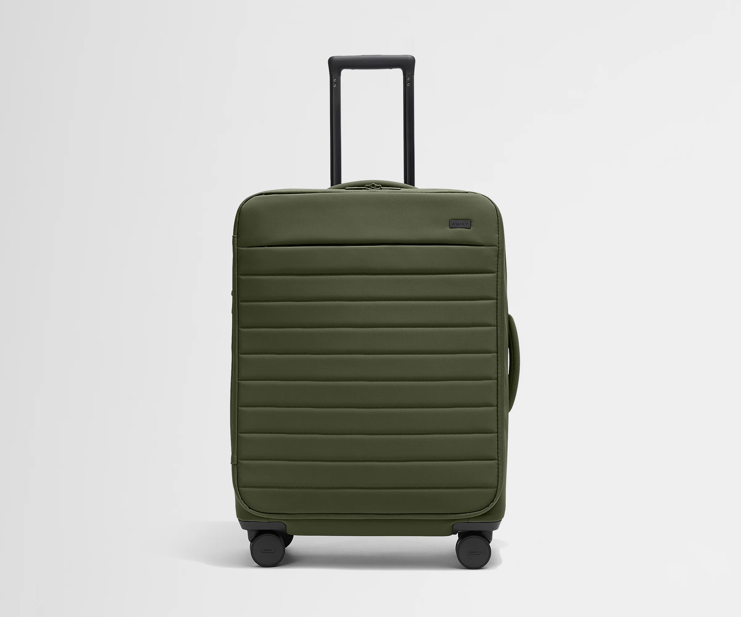 Front product view of The Softside Medium suitcase in Olive Green with raised handle