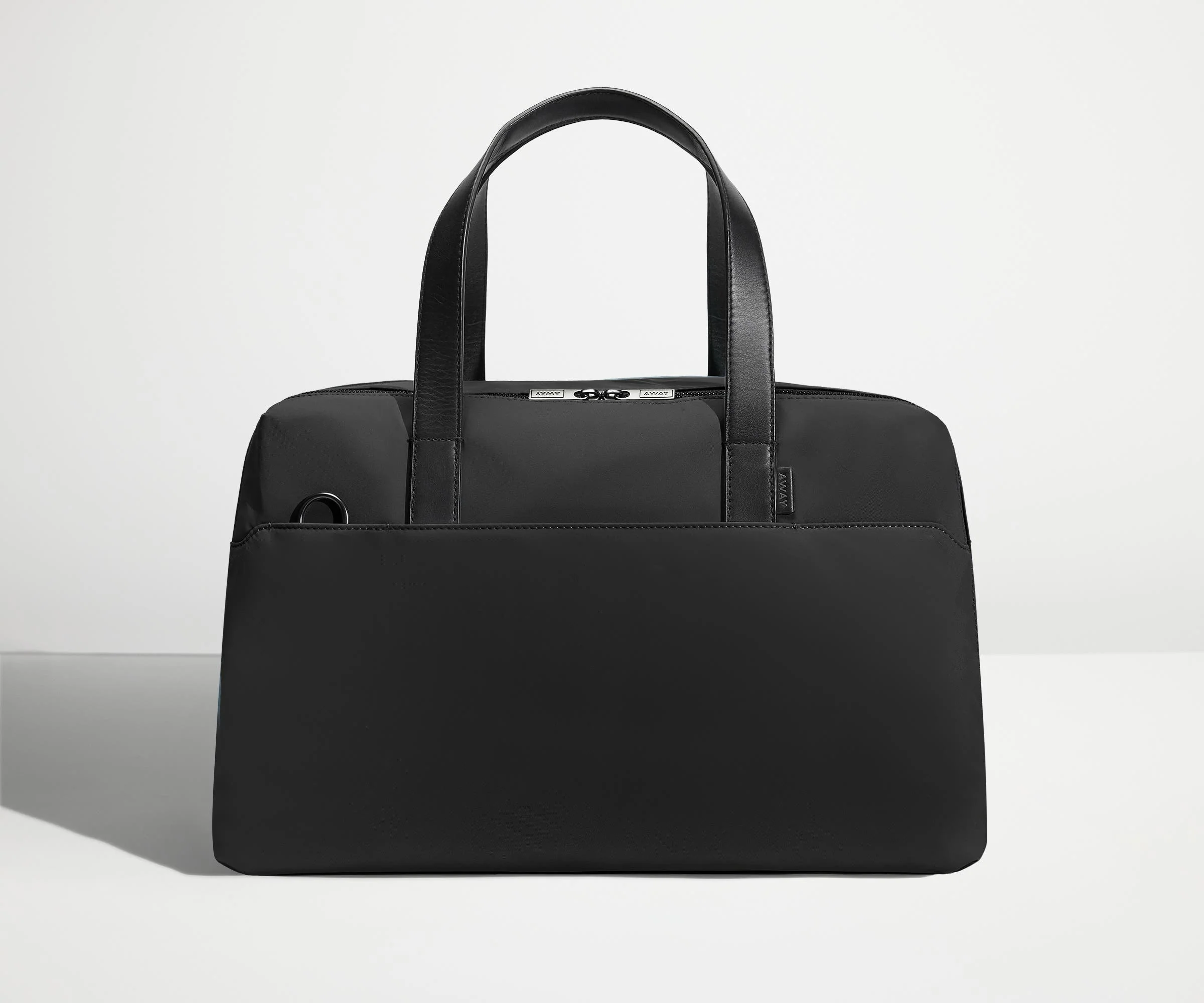 Front view of The Overnight Bag with leather straps up