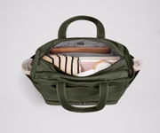 Back main compartment packed with adult travel essentials, including a laptop, notebook, and extra clothes
