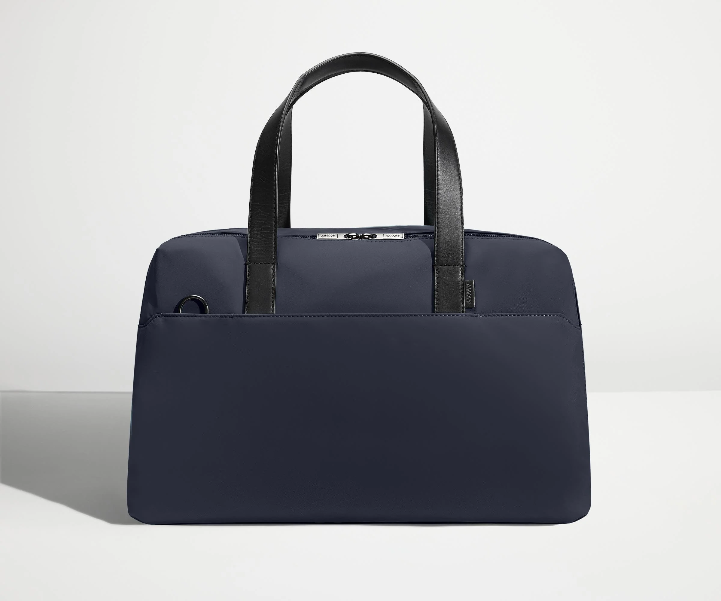 Front view of The Overnight Bag with leather straps up