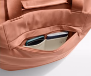 Phone and passport packed in an exterior zip pocket