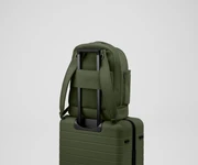 Double Diaper Backpack on top of an Away suitcase by the trolley sleeve