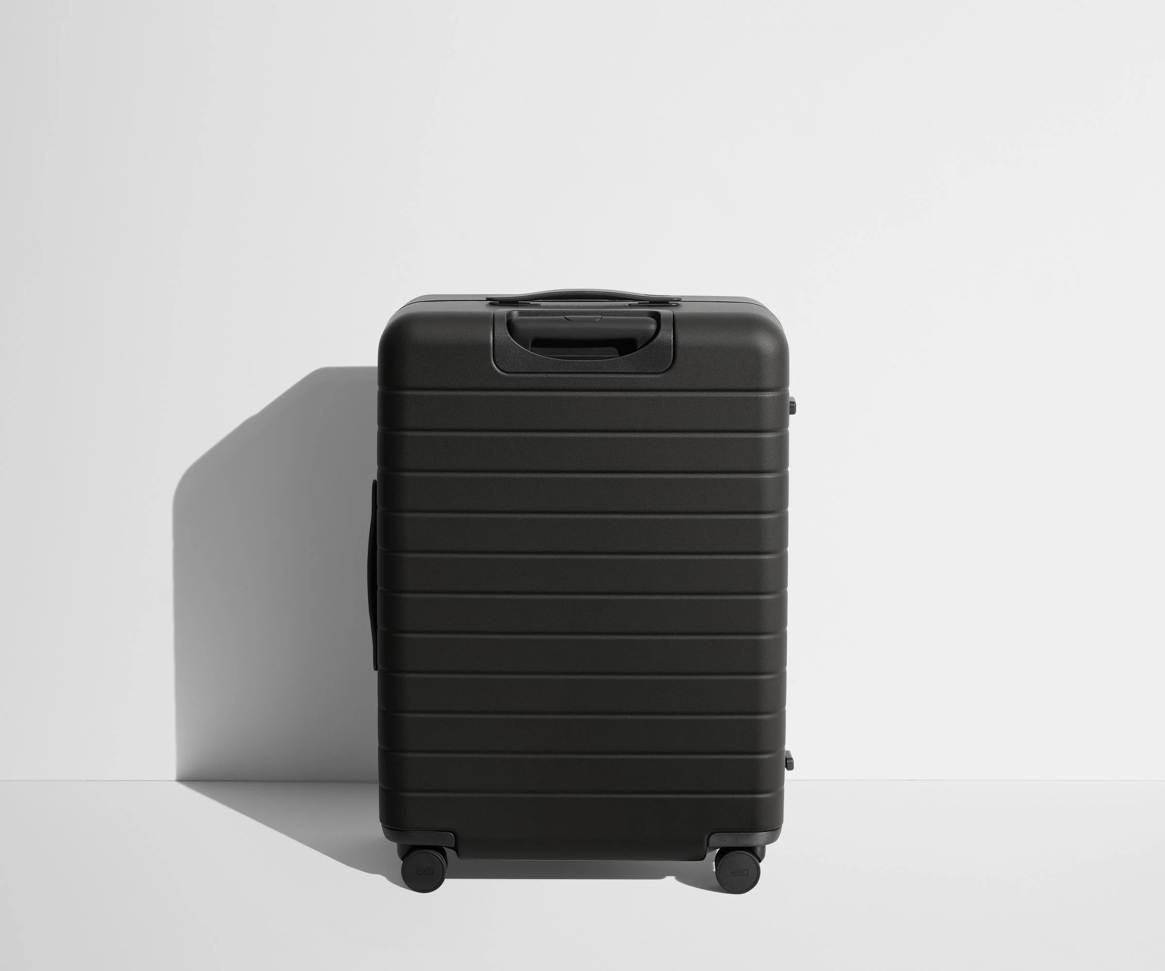 Back product view of The Medium suitcase in Jet Black
