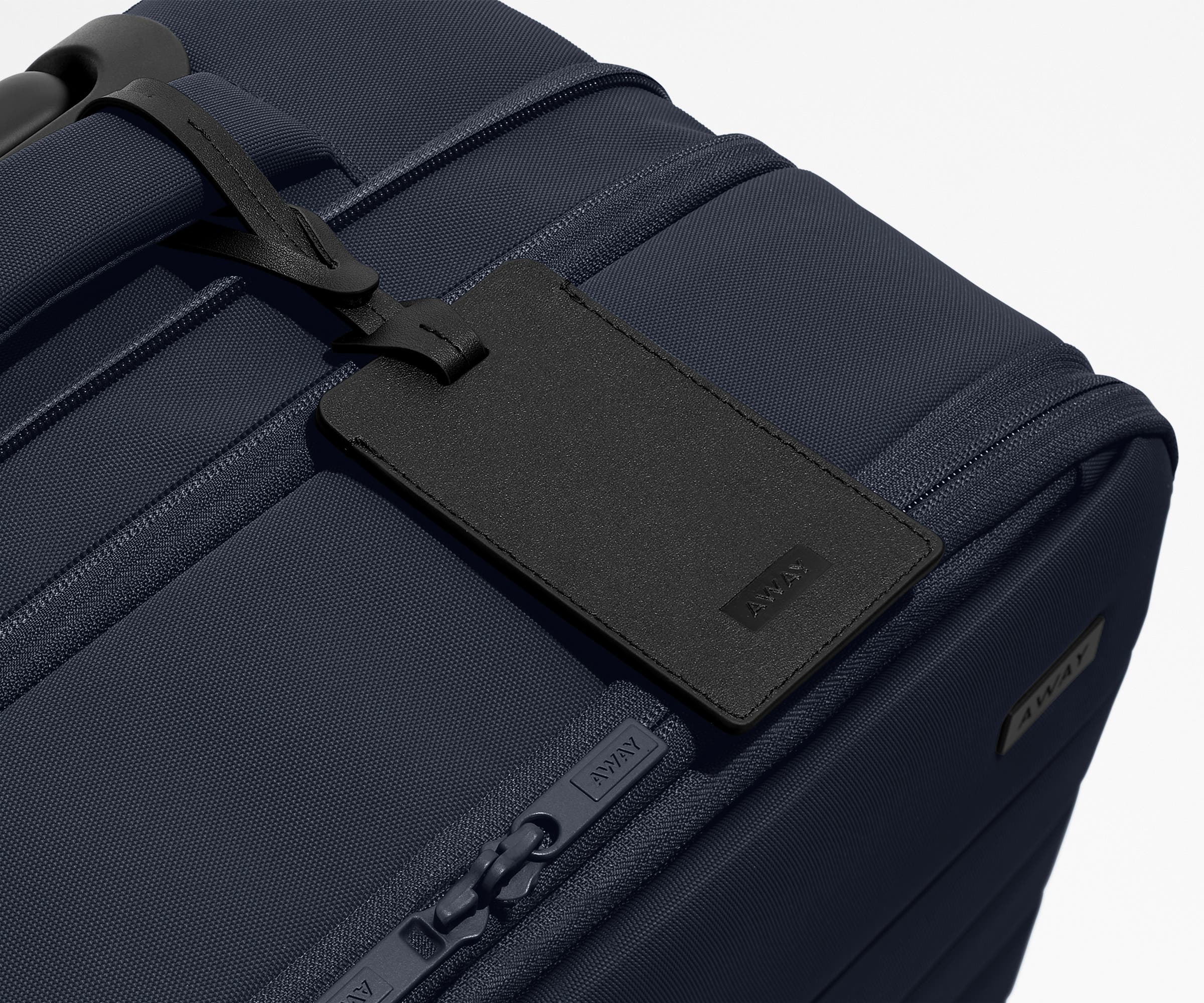 Black leather luggage on that comes with the Softside suitcase