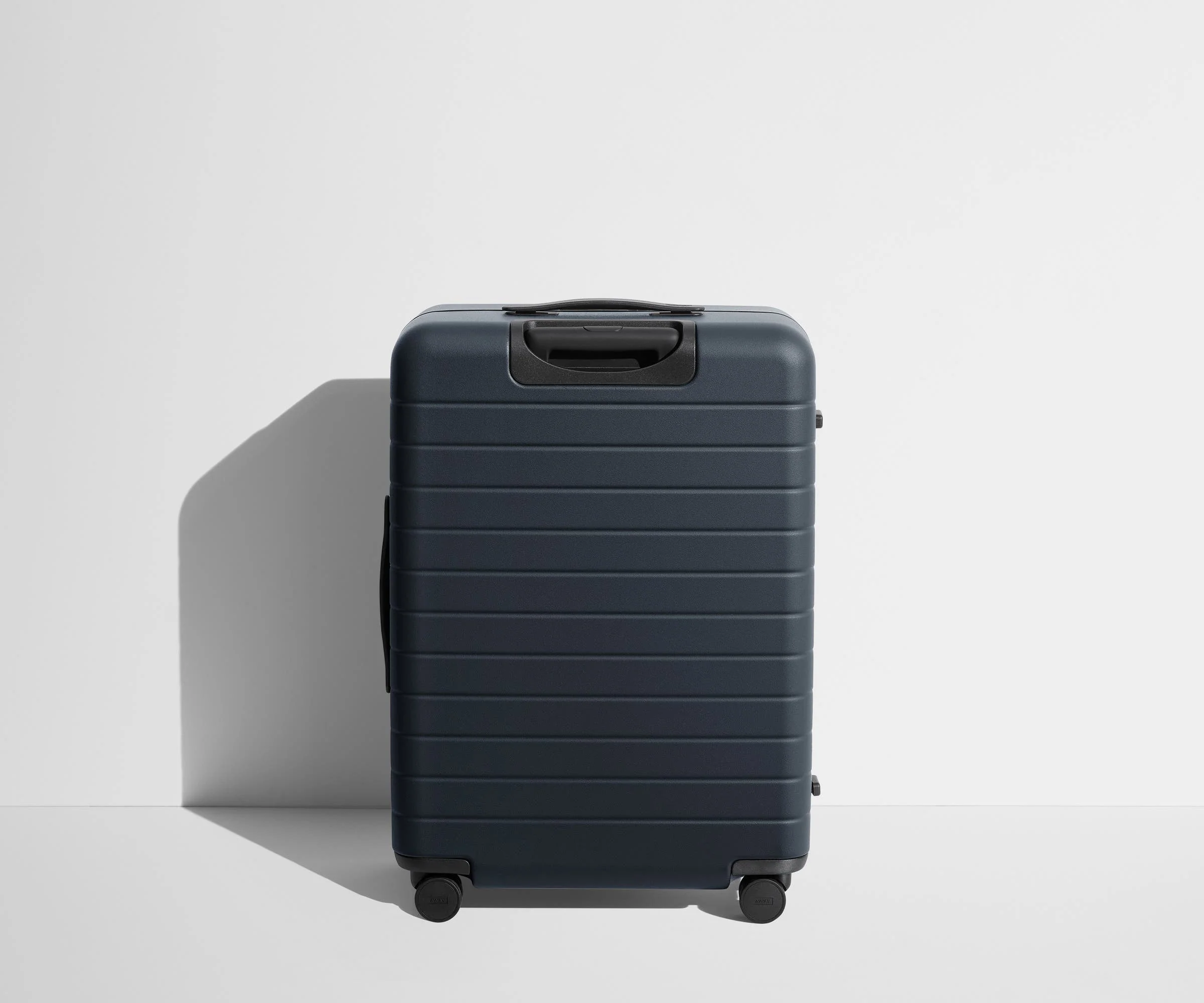 Back product view of The Medium suitcase in Navy Blue
