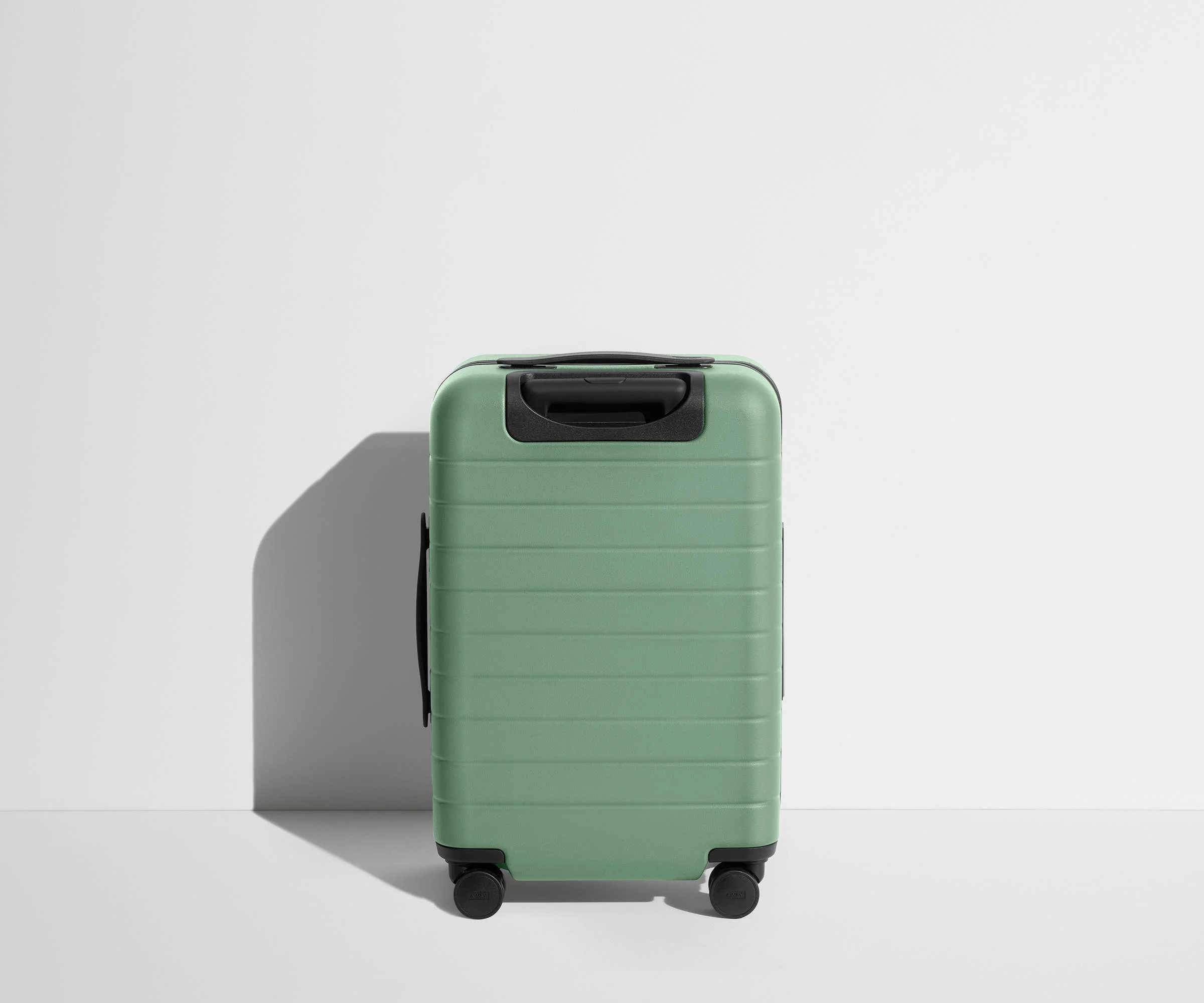 Back product view of The Carry-On suitcase in Sea Green