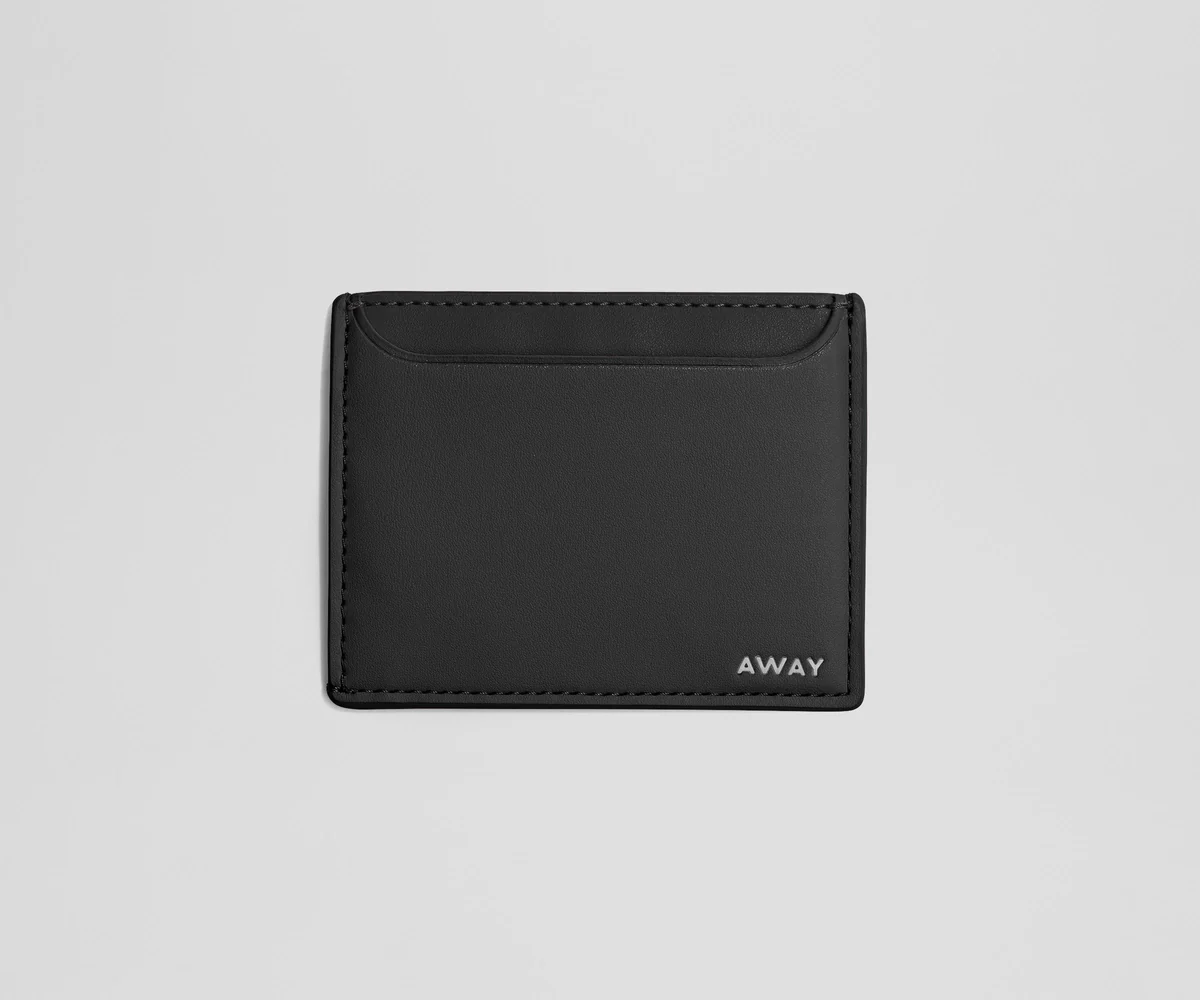 Front view of the Circle Zip Pouch with the leather strap