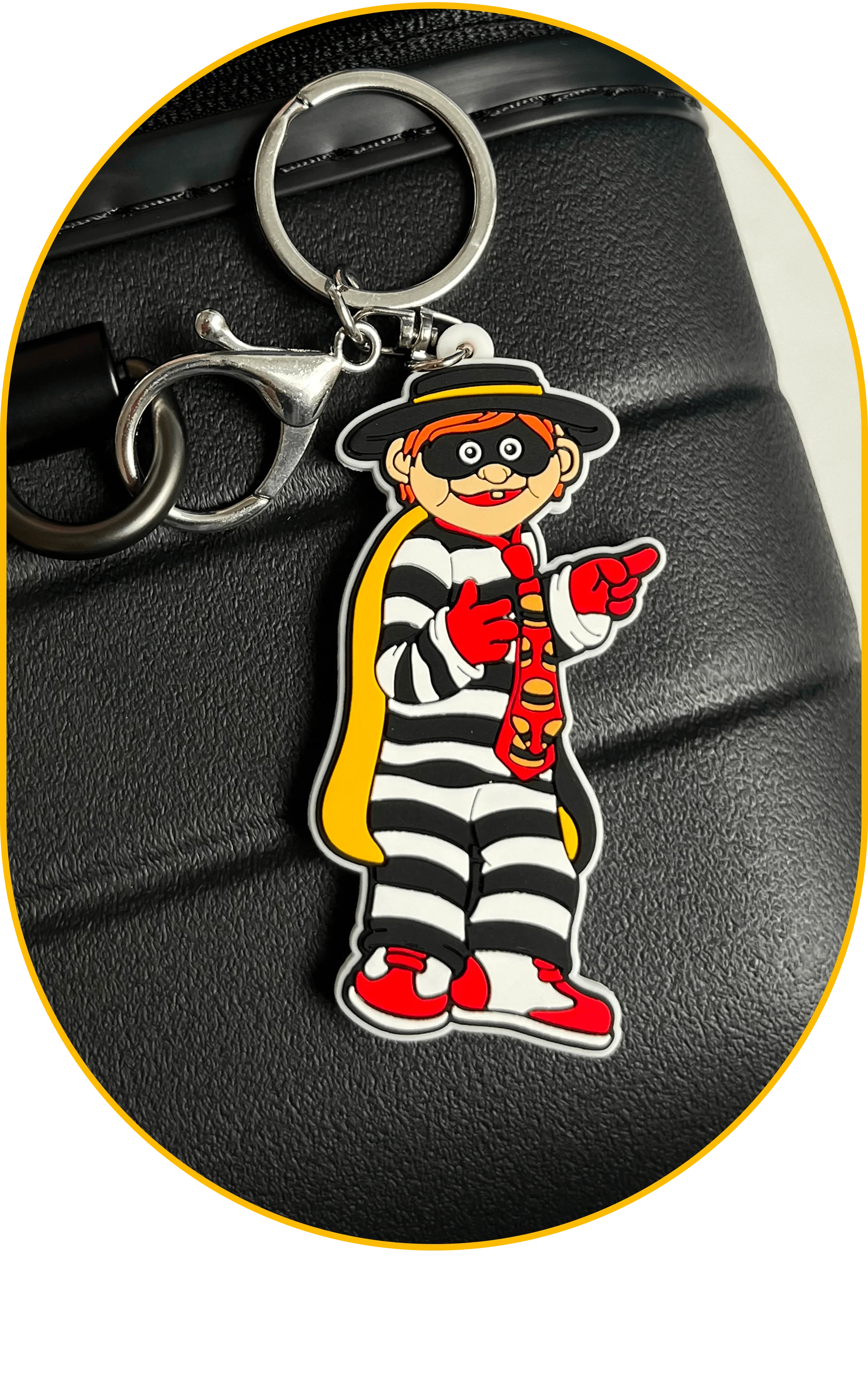 A Hamburglar luggage charm: Definitely smuggling sauce through TSA.