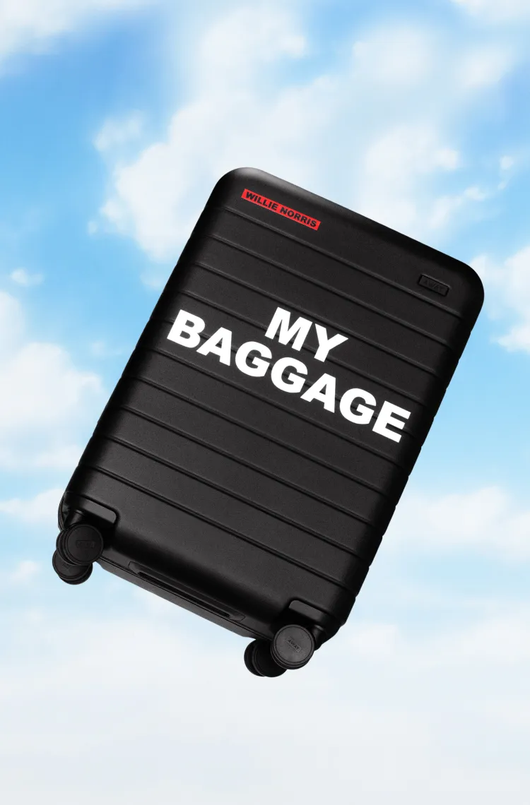 A black Away carry-on suitcase with the  text 
